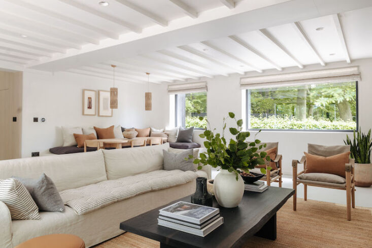 the open plan living area with views of the nearby woodland. the coffee table i 22