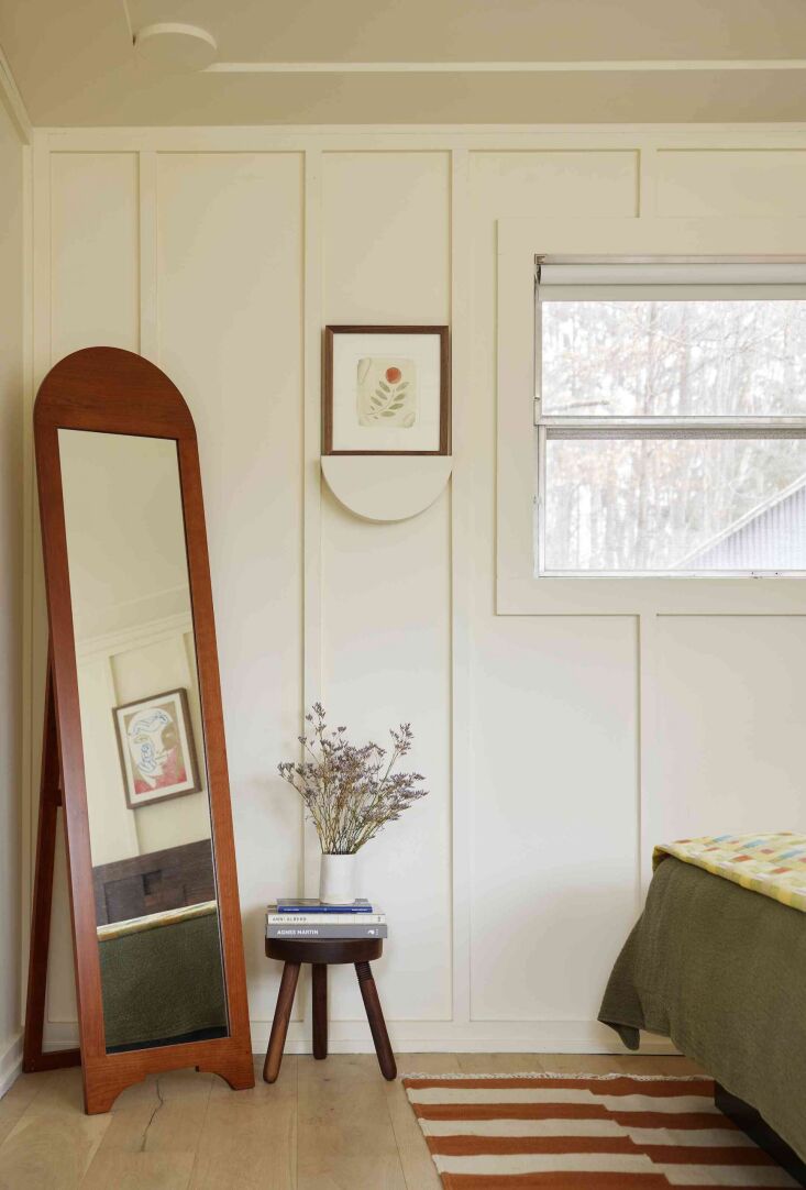 arched shapes are a recurring theme, as in this wooden standing mirror and clev 19