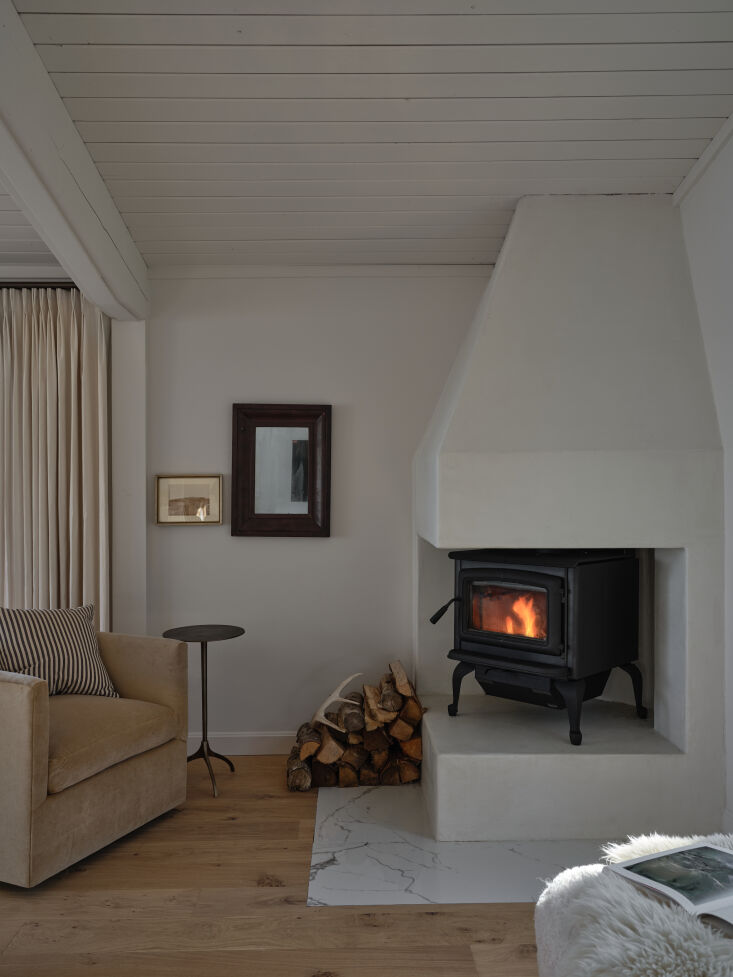 above: the original brick fireplace got a modern makeover, including a glass fa 15