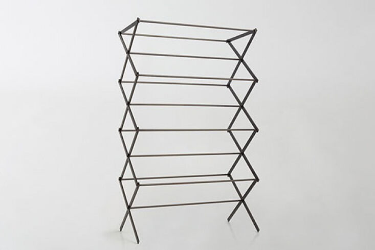 the march drying rack, made of patinated cold rolled steel, is modeled after a  23