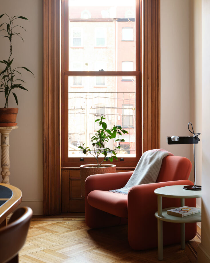 a colorful corner of the dining room thanks to the coral hued chiclet chair by  19