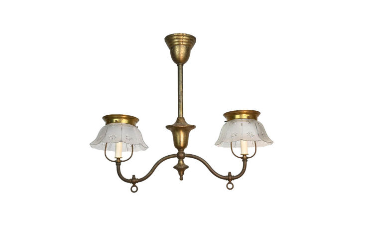 the antique chandelier is a converted gas fixture from bijan royal. for somethi 25