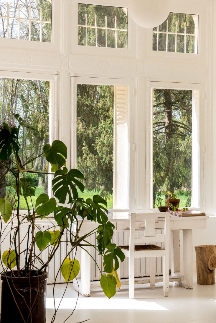 a jean royère desk in the artist residence space looks out onto the ground 15