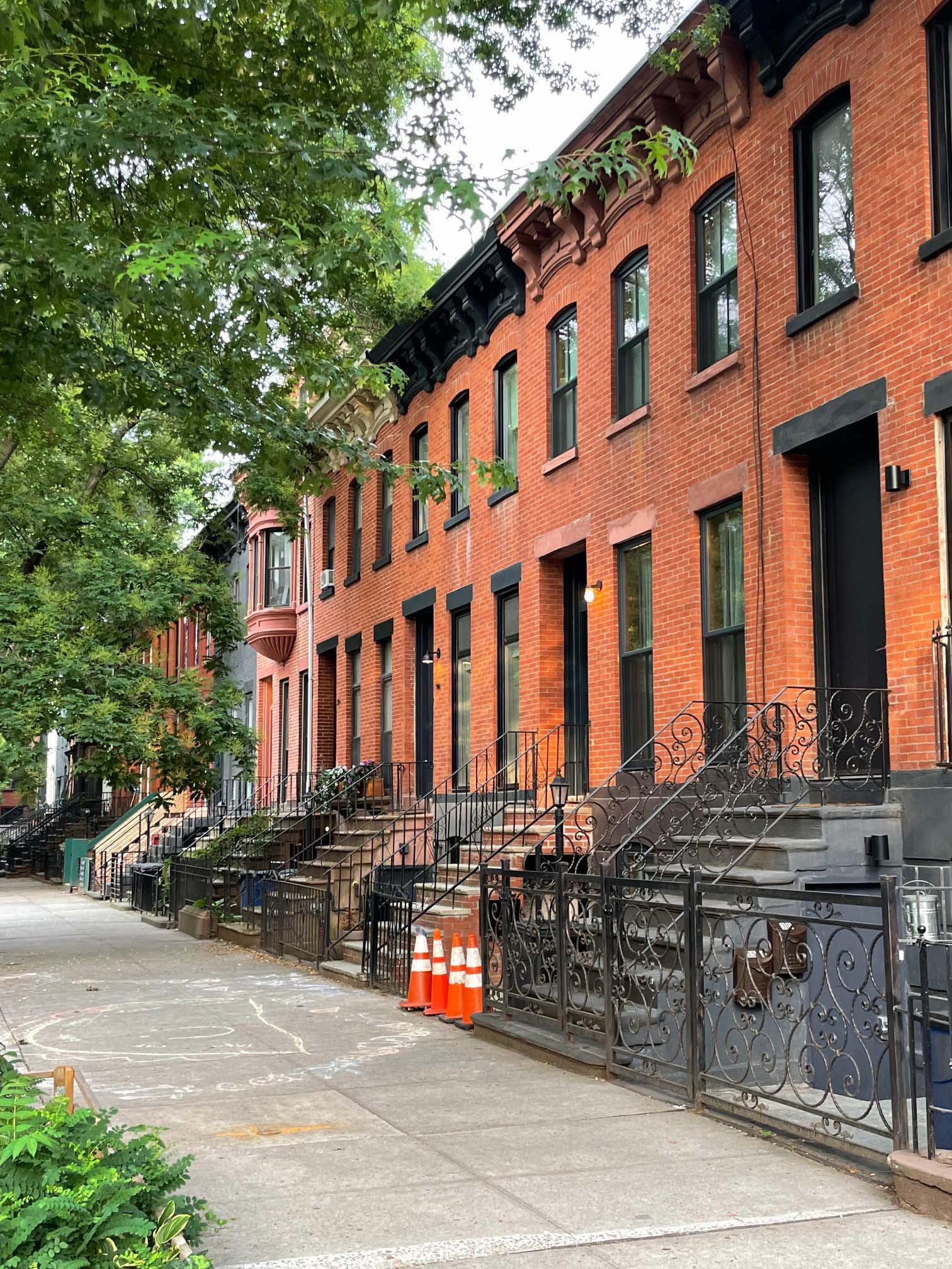 the federal townhouse is part of a row of adjoining brick structures on a quiet 14