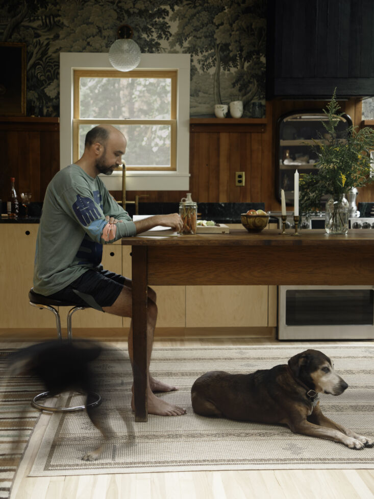 the table pairs well with the pine paneling. andrew—shown here wearing a shir 22