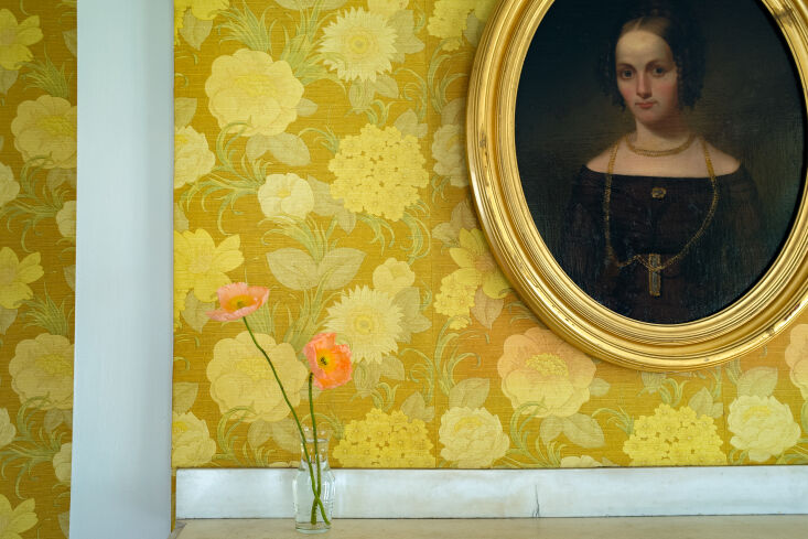 alexa and co. preserved the bright yellow wallpaper in the front room, which da 17
