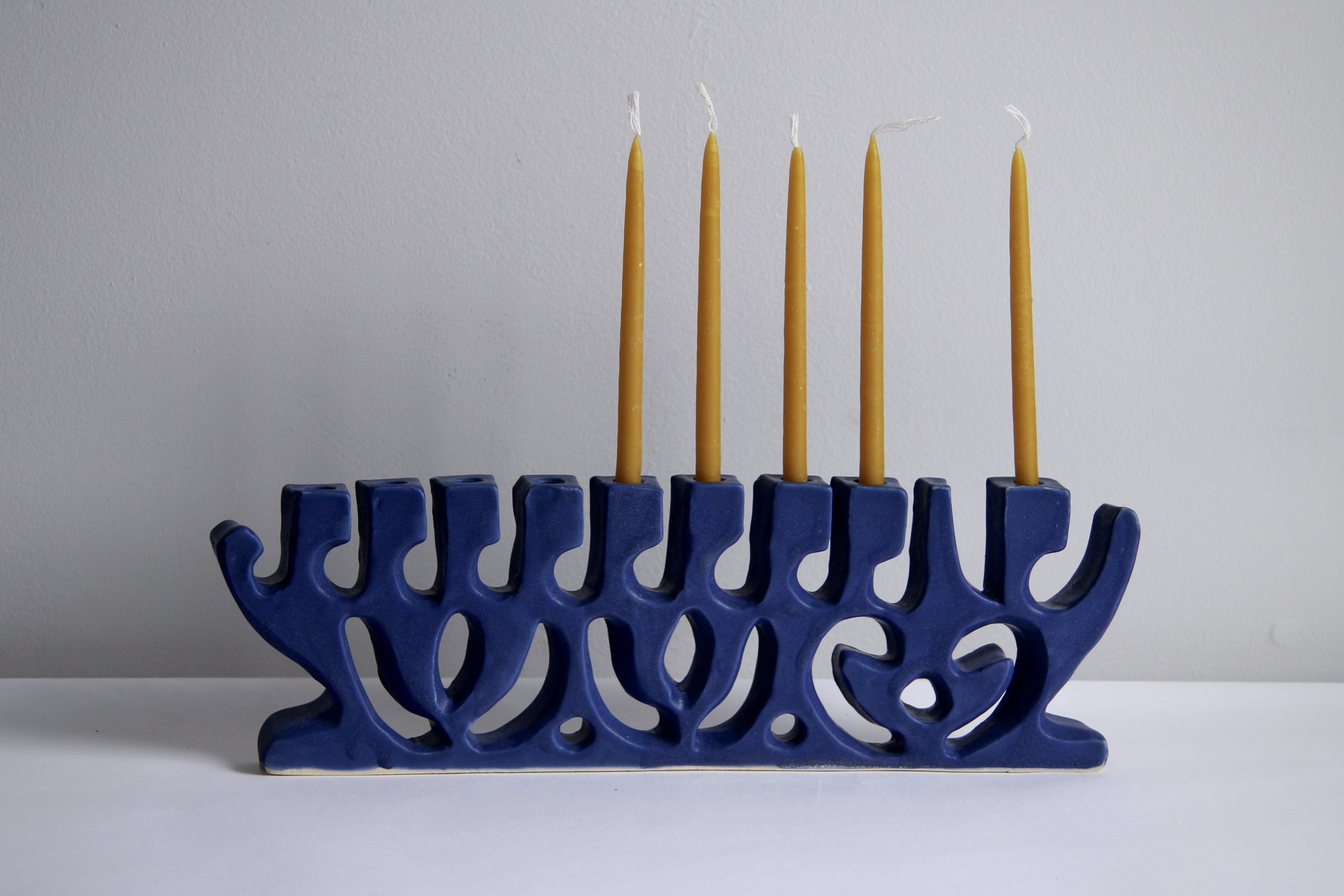ank studios&#8\2\17; menorahs this year are glazed in shades of blue or whi 17