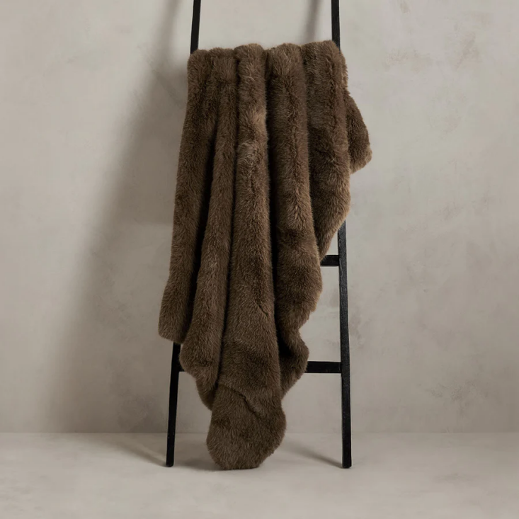 handmade in indonesia, the kodiak faux fur throw (from $295) features an exce 18