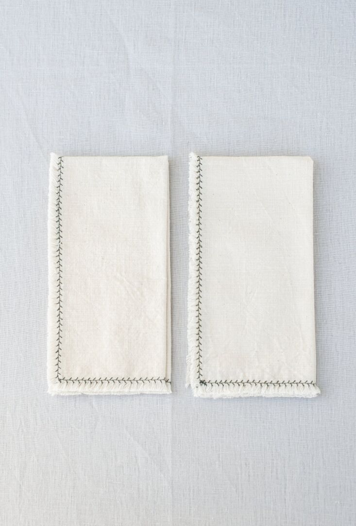 the cotton flamé natural napkins with bottle green branch are made from \1 15