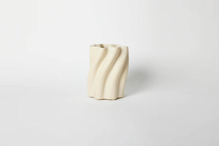 the clam lab cream tall wavy vase is \$980 at the primary essentials. 24