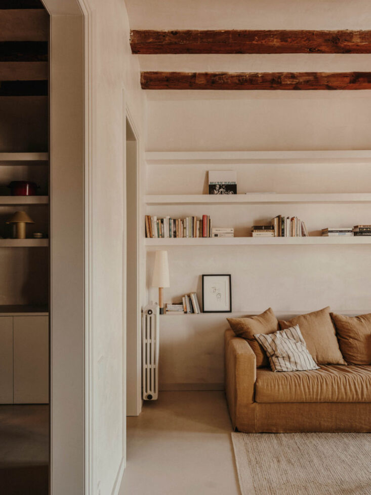 minimalist built in wall shelves in the living area feel both modern and timele 14