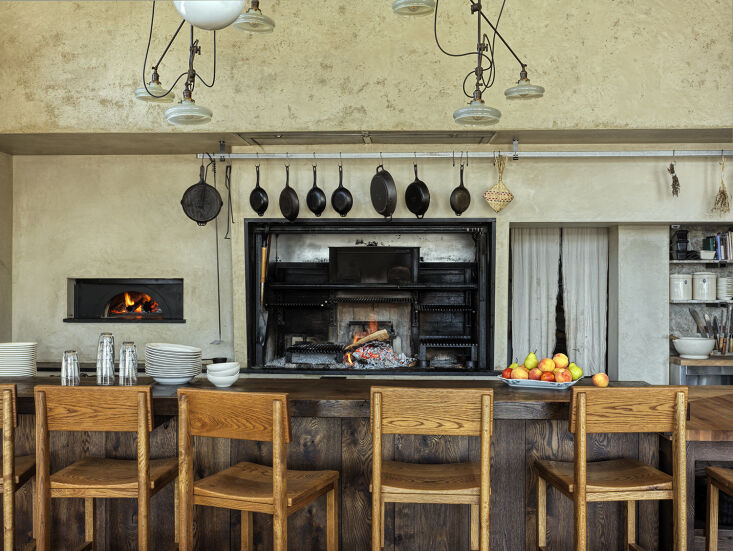 the heart of the restaurant is the open hearth and kitchen, with cast iron pots 20