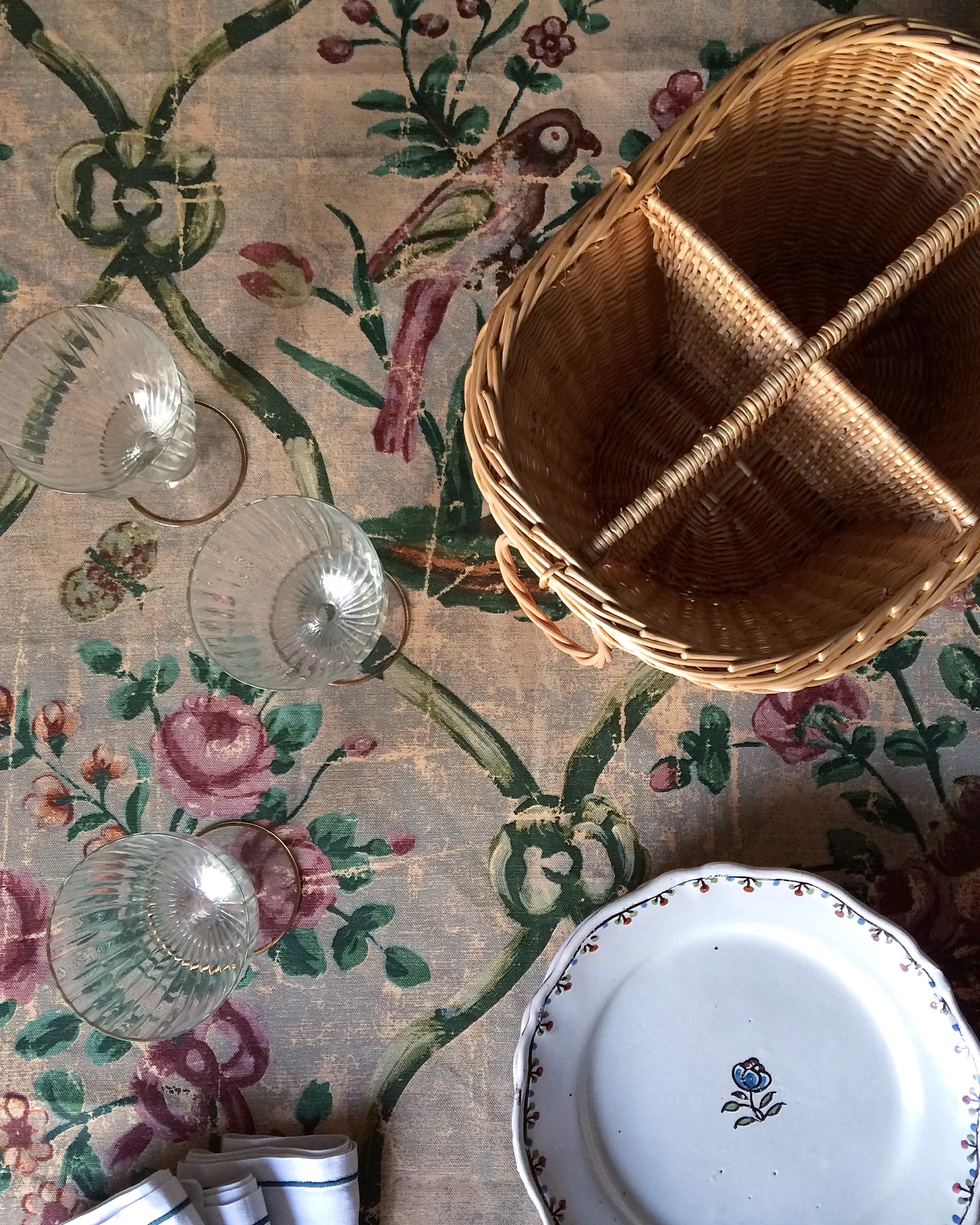 a tabletop vignette with a weathered oil cloth and the family faience. 24
