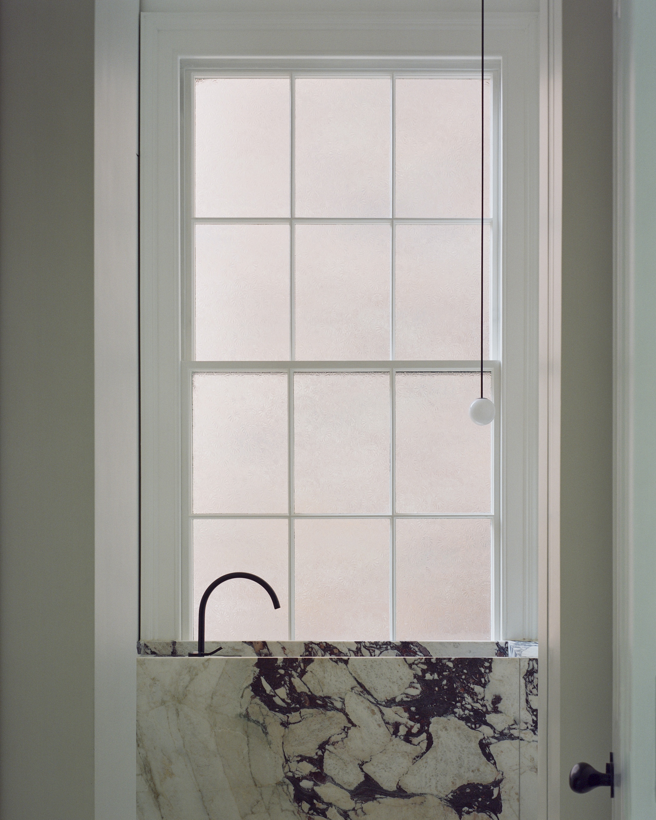 a window side marble basin. 31