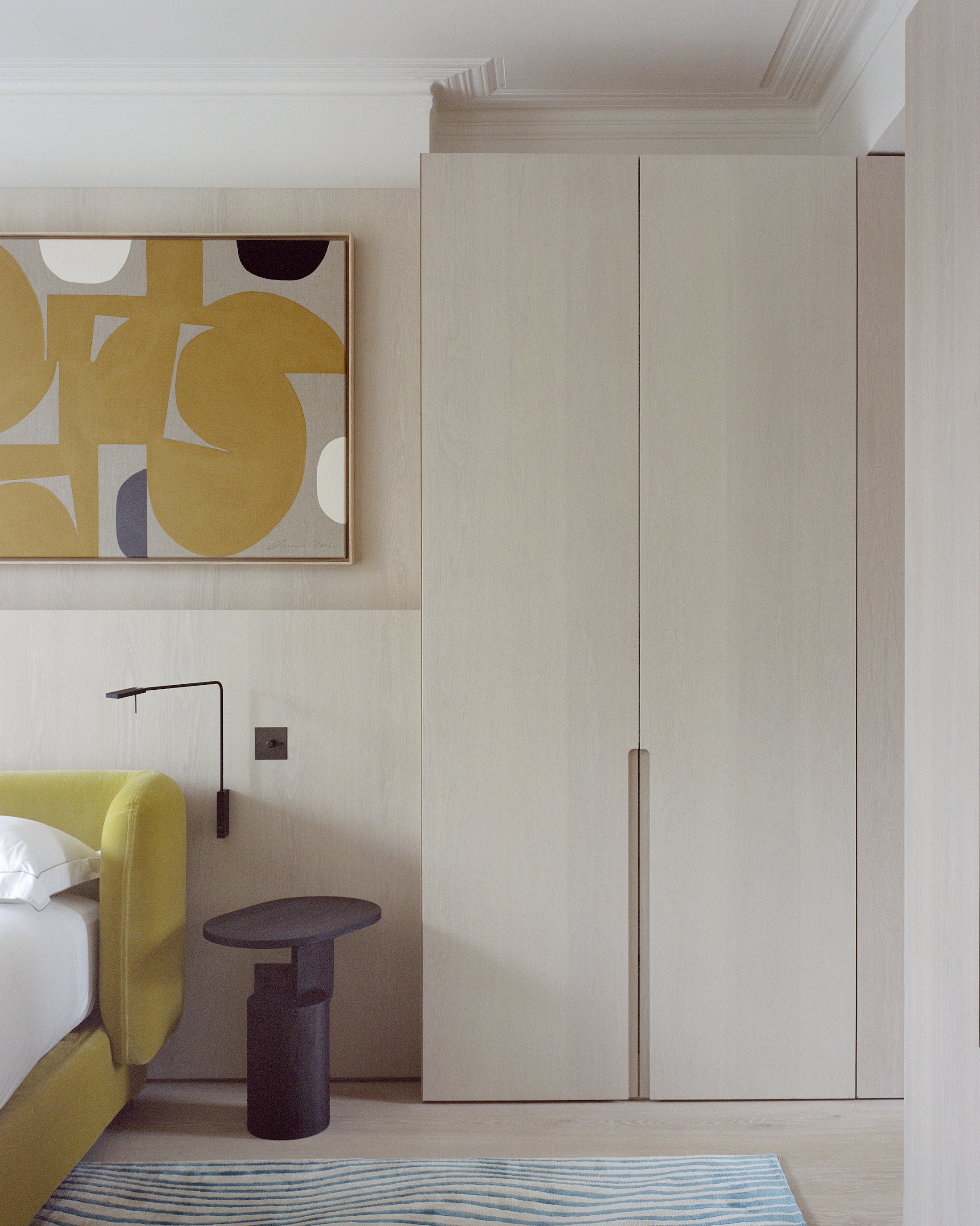 a guest room has bedside roy wall lamps from italian brand viabizzuno and  30