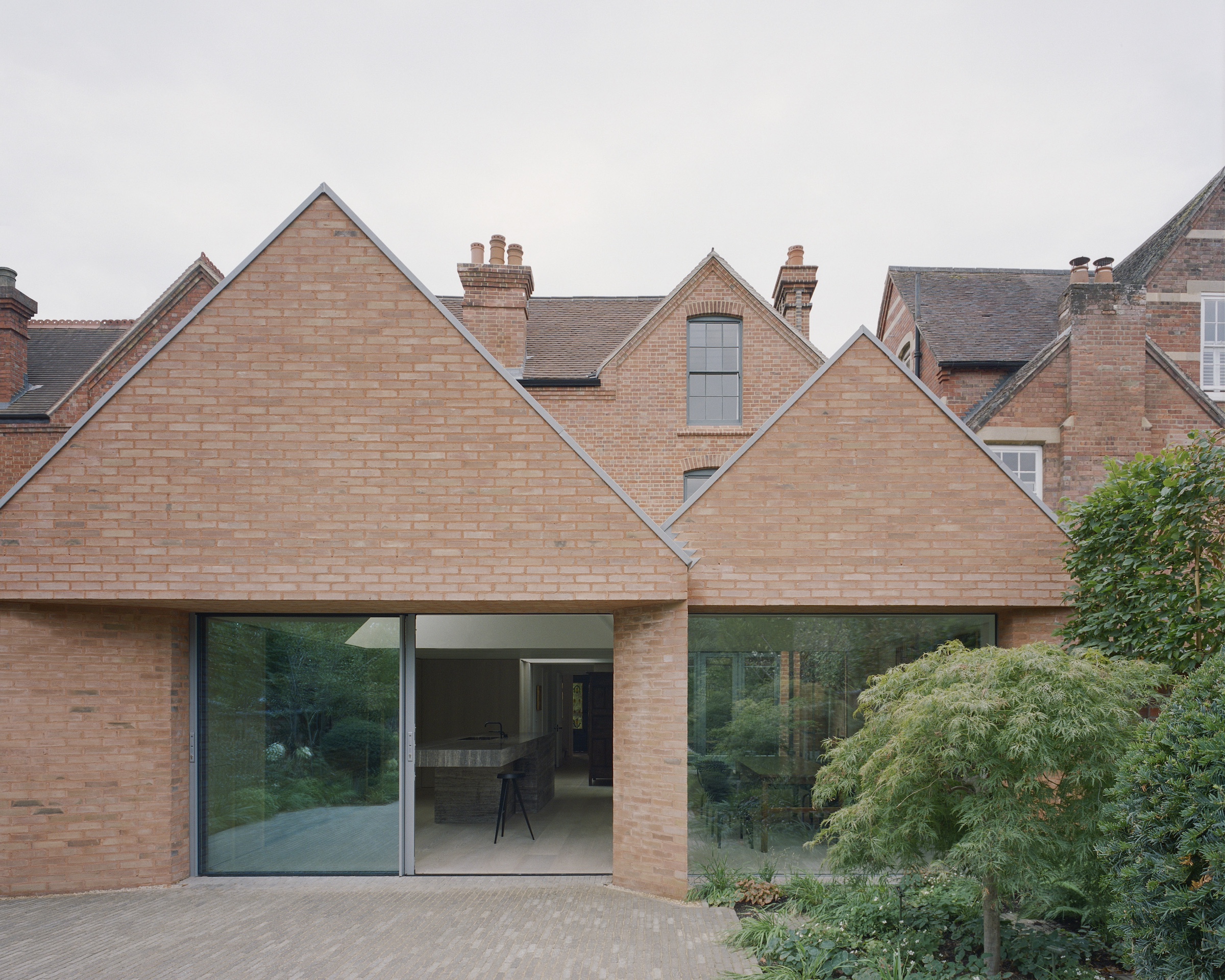 &#8\2\20;brick soffits were used to form deep reveals above the large, glas 19