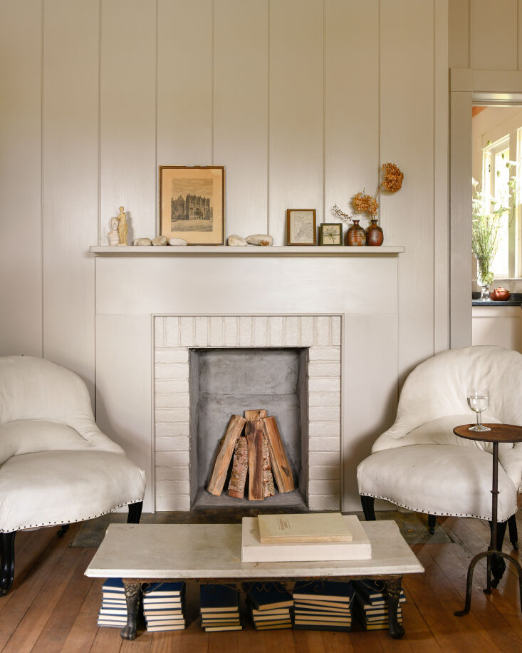the original working fireplace. the napoleon chairs were sourced from jayson ho 22