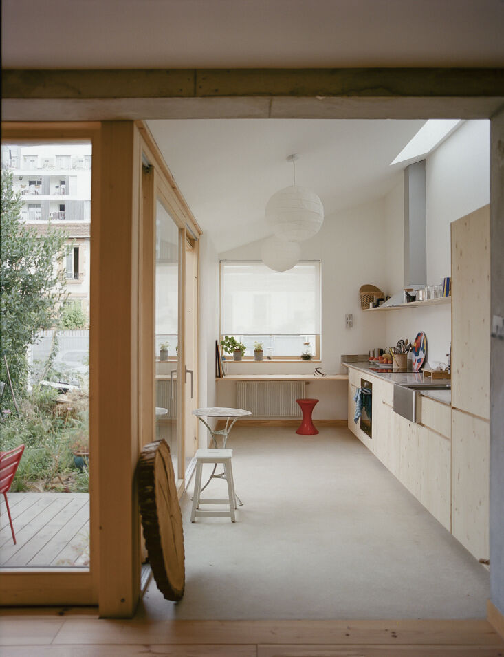 the custom kitchen is built out of 3 ply spruce panels coated with a clear sati 21