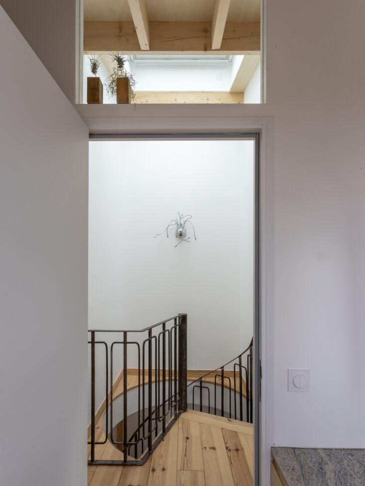 mudo integrated a circular skylight above the original staircase to bring natur 33