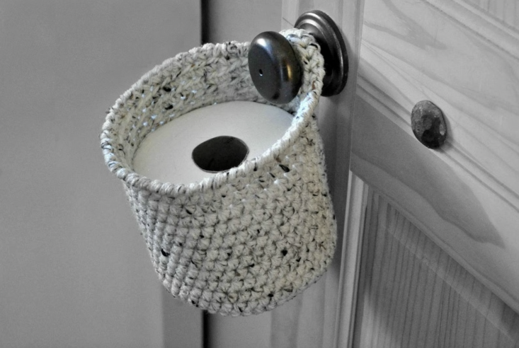 a crocheted toilet paper holder is \$\25 from a and b design studio, an etsy se 25