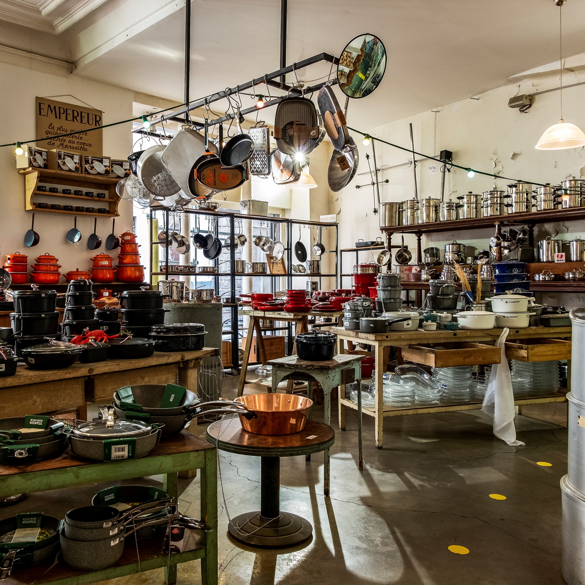 the center of the ground floor store is stacked with cookware. 23