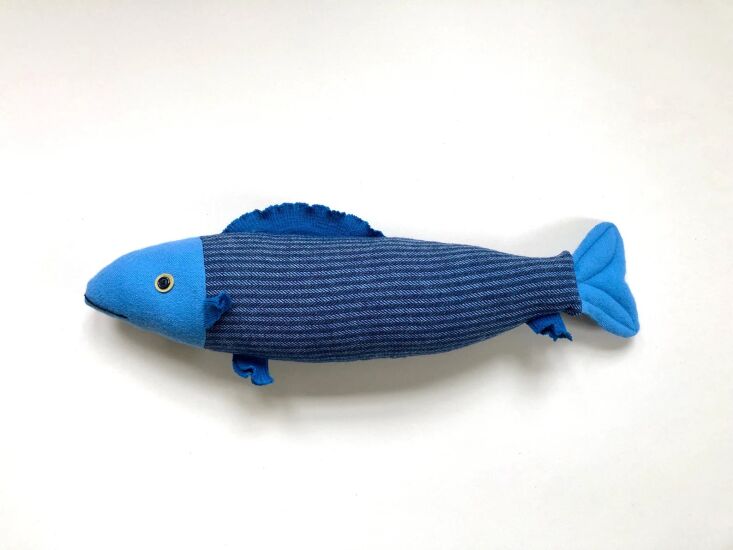 maker mimi kirchner sells these blue fish pillows (among many other colors); \$ 30