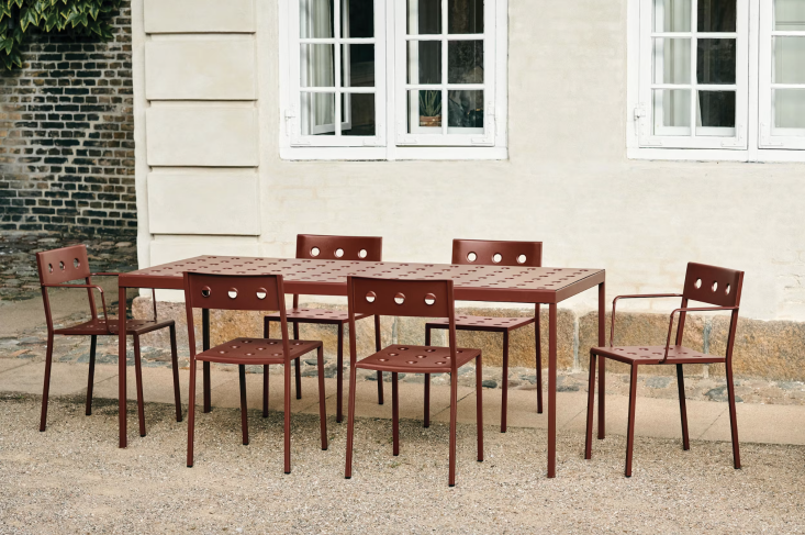 an indoor/outdoor offering from hay: the balcony dining table is punched throug 27