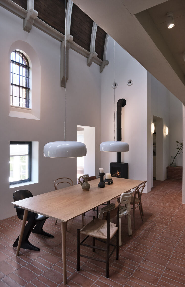 the wood burning stove is from dik geurts. the pendant lights are the jasper mo 23