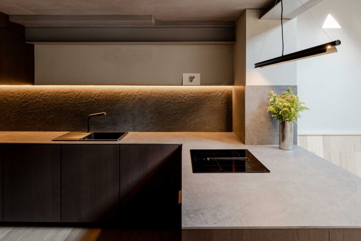 natural stone countertops create an organic atmosphere among minimalist applian 24