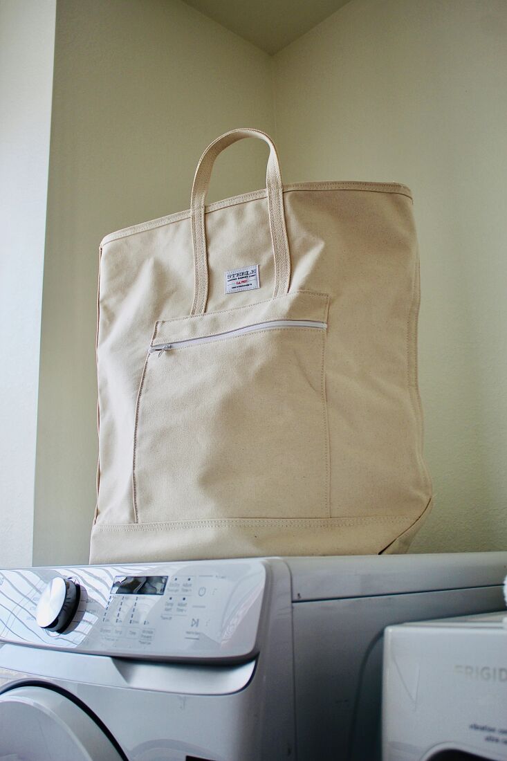 the steele canvas laundry tote is \$\1\19.95, available in natural or black. 19