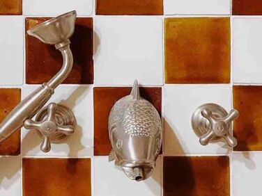 wall mounted taps with fish head francone bespoke taps  