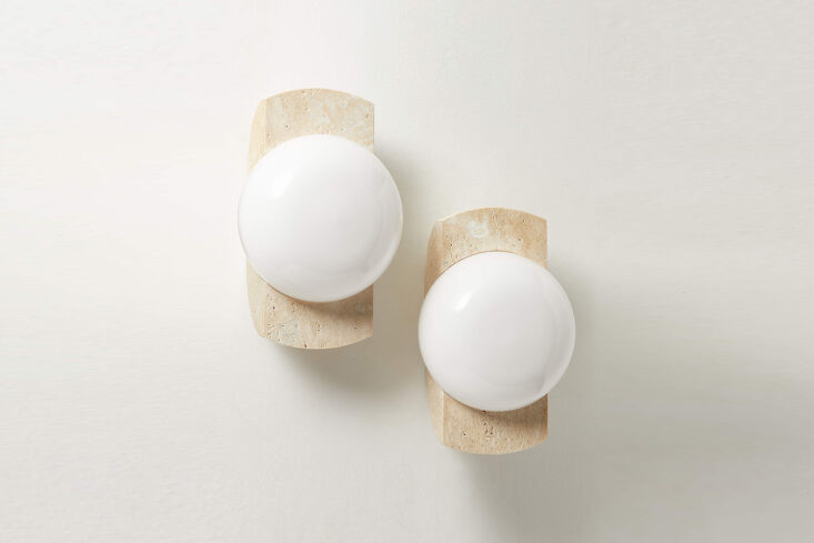 the neptune wall sconce is available in ivory travertine (shown) or green marbl 28