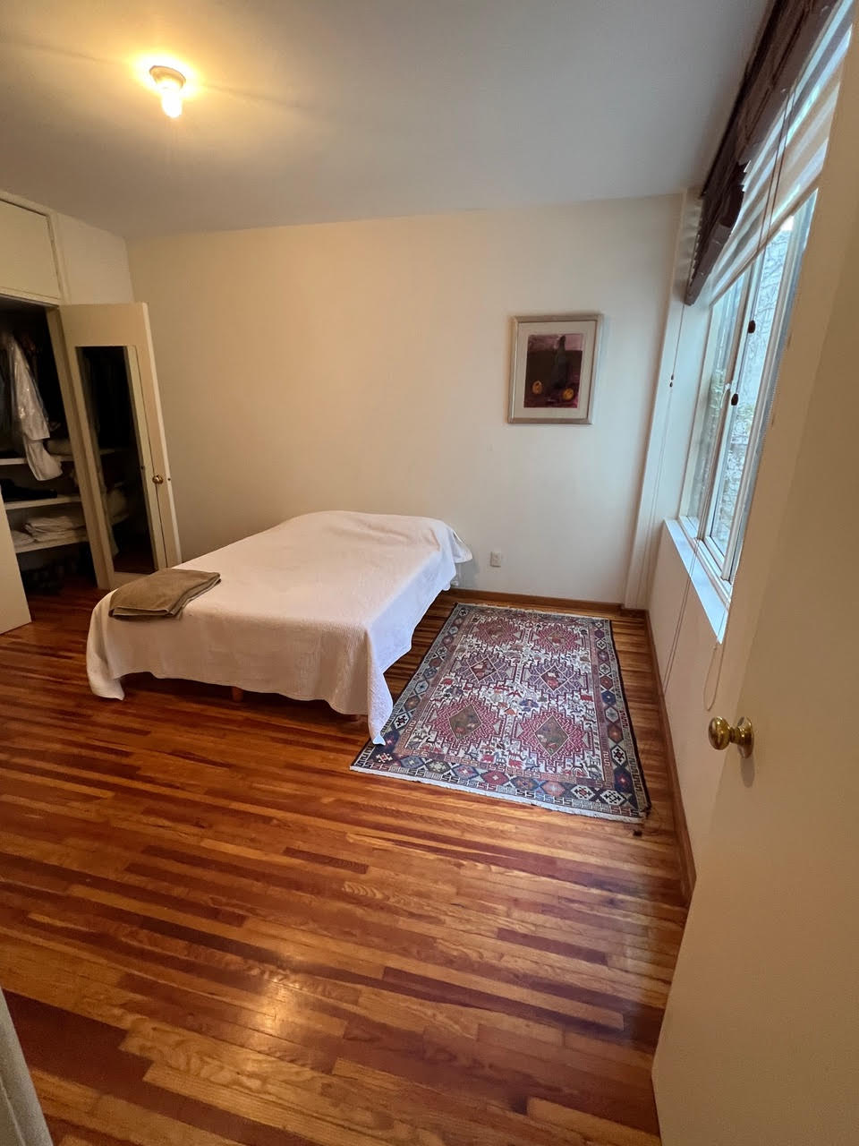 a bedroom offers a look at the multi toned pine floors—they required ble 37