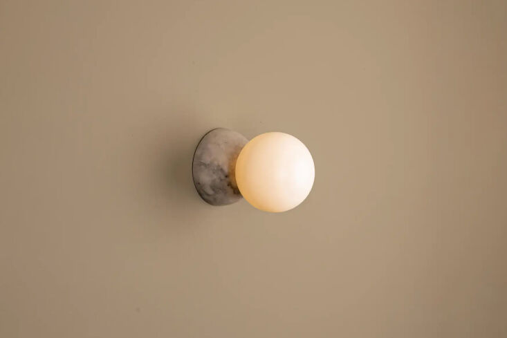 the simone & marcel designed eklipso tobacco alabaster wall sconce is \$659 23