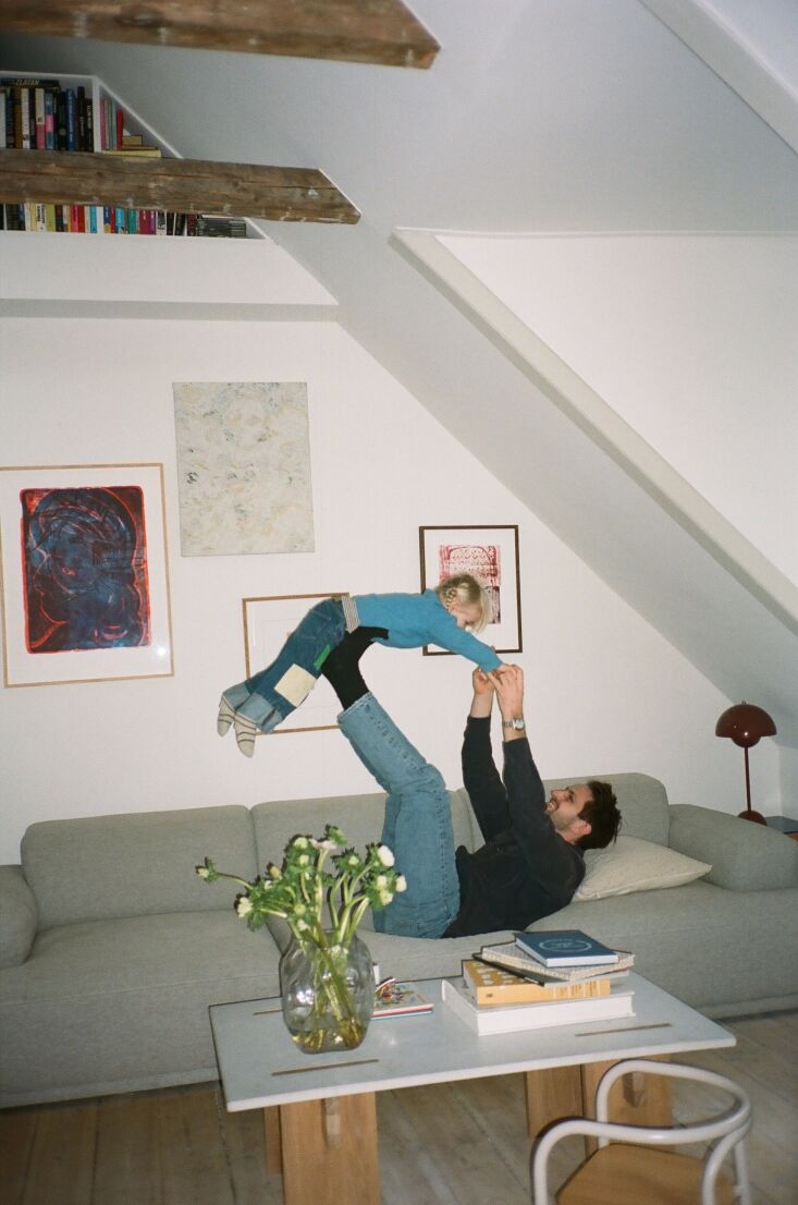 magnus and ruth on their muuto connect modular sofa. the print on the far left 19