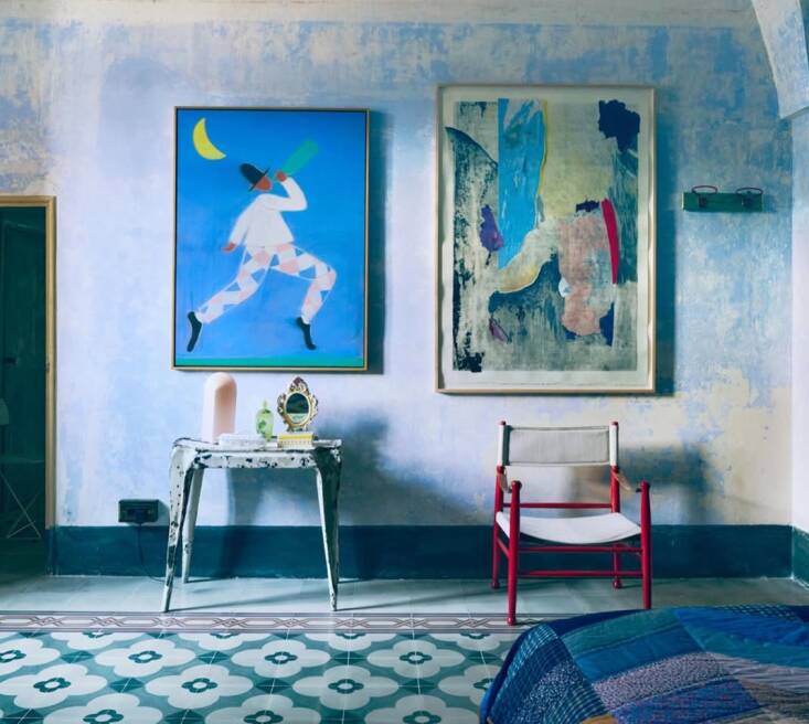 at villa colucci, a red painted canvas chair in an otherwise blue room. photogr 17