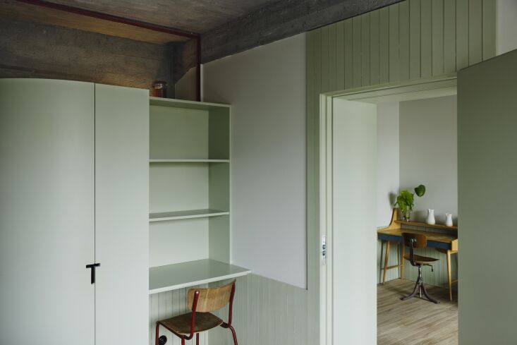 small desks are integrated into the guest rooms in various places. a vintage mi 26