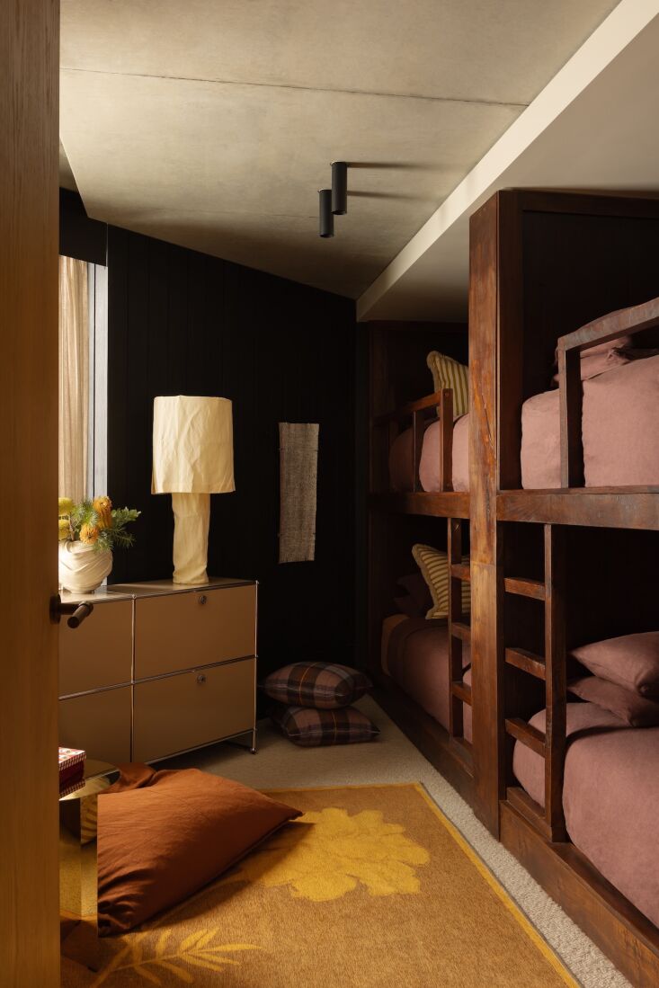 brem put an odd, triangular shaped room to use by building custom bunks: &# 26