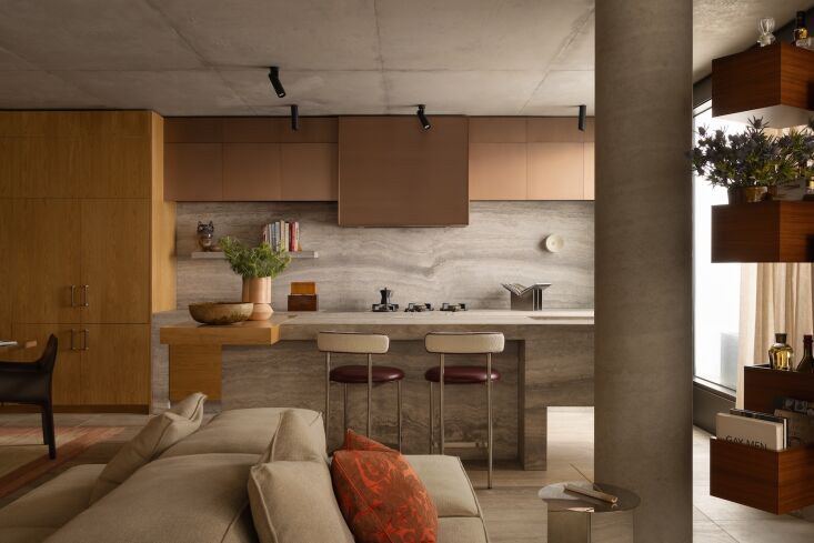 the existing kitchen island is now clad in travertine and birch plywood cabinet 22