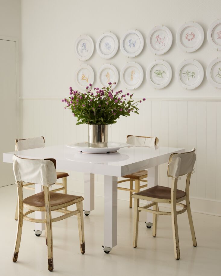 zodiac plates on display along with a vintage table on wheels and chairs (compl 22