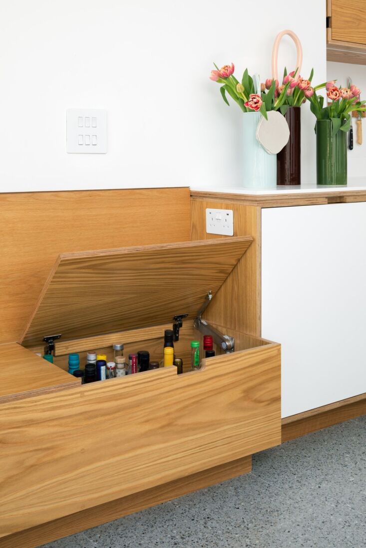 in a hackney eat in kitchen, a long table bench provides extra storage, includi 18