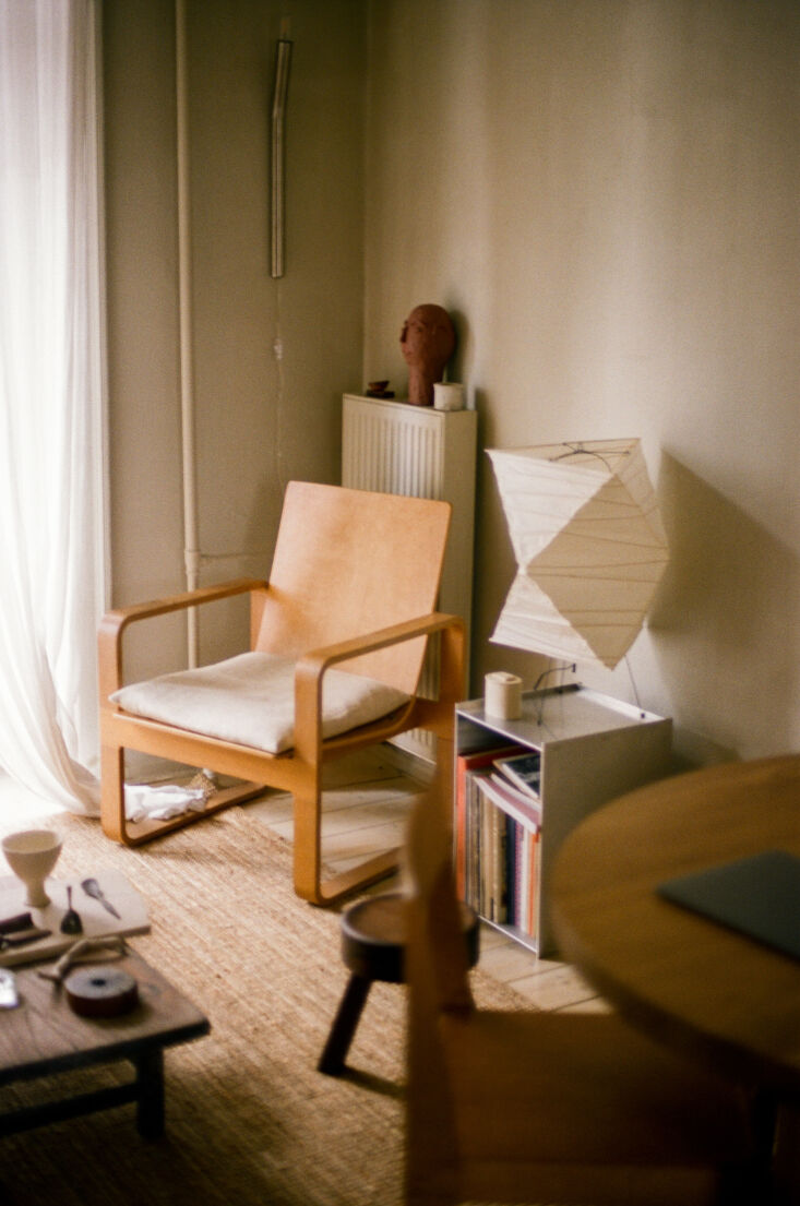 a vintage thonet bentwood lounge chair, a frama aml stool in dark pine, and a f 25