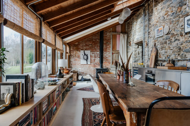 skylights and a wall of windows usher in natural light. 20
