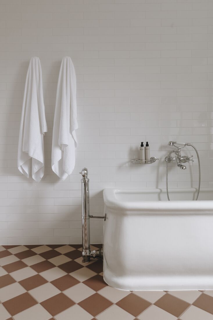 freestanding baths and checkerboard terracotta floors reference early \20th cen 29