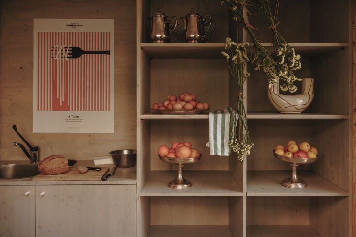 footed antique platters and modern ceramics decorate the kitchens of suites and 25