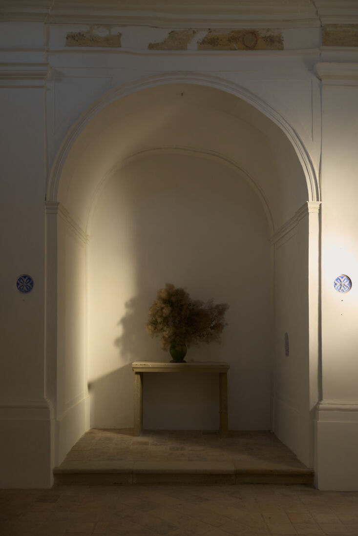 a dried floral arrangement in one of the church arches. 35
