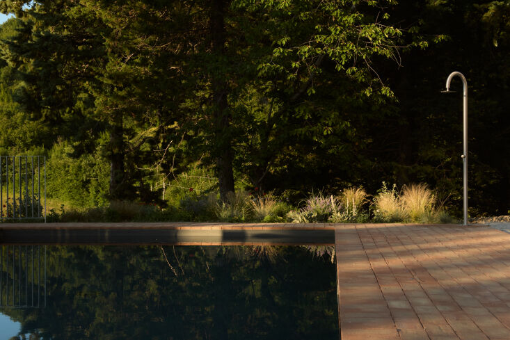 the pool is equipped with an outdoor shower. 29