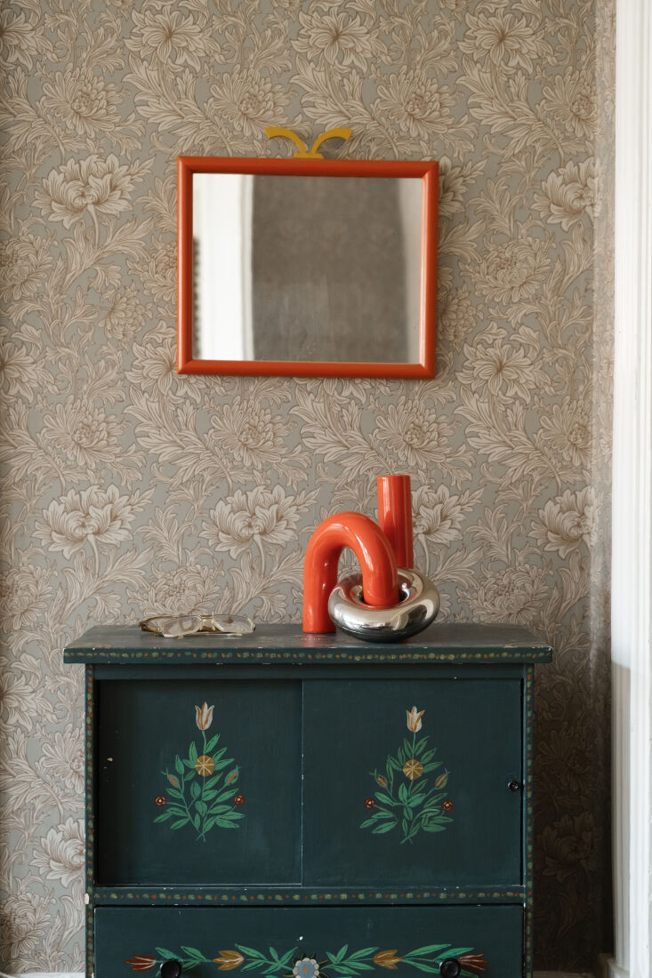 the dog\2\17;s gear is kept near the entry in an antique swedish chest. 21