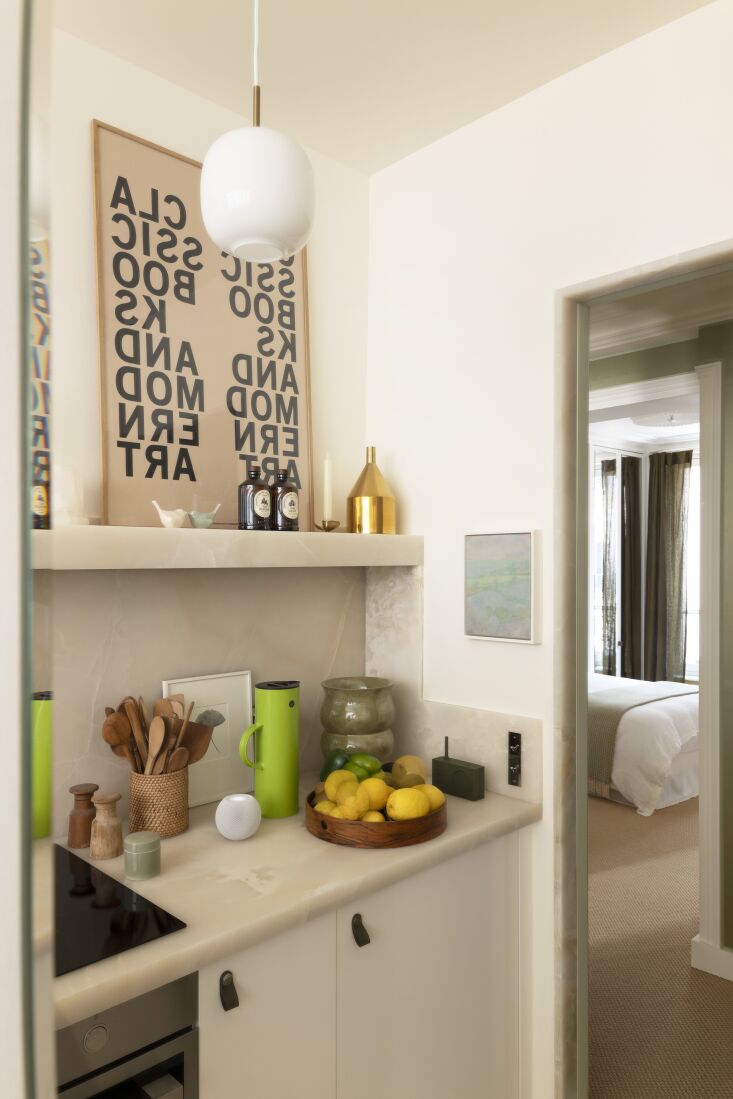 a louis poulsen vl 45 radiohus pendant hangs overhead. 27