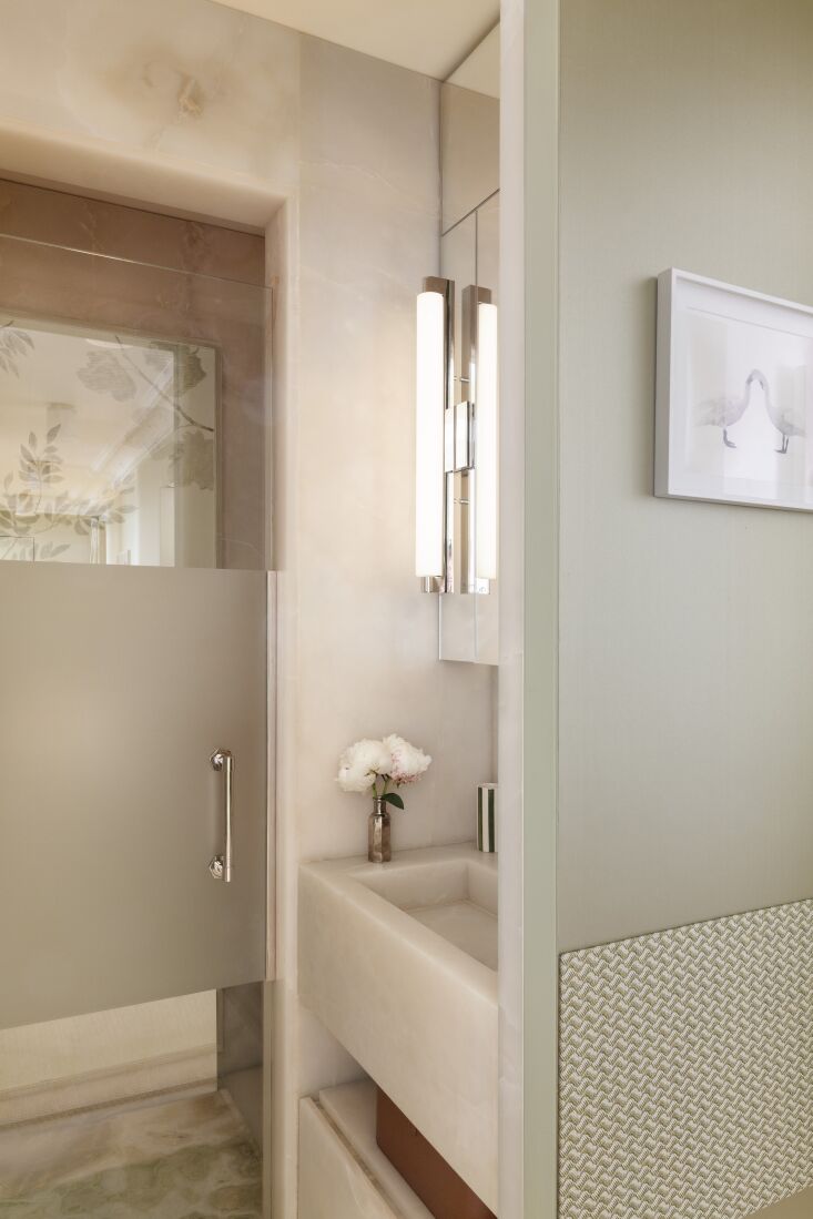 the concealed bathrooms draw inspiration from versailles interiors. as with the 30